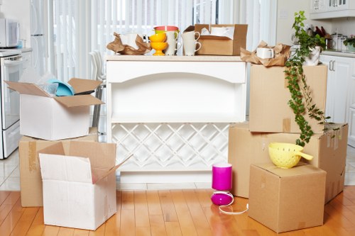 Professional movers handling office equipment