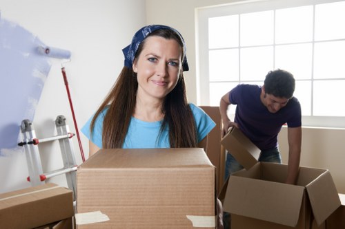 Professional movers handling office furniture